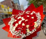 fruit basket with a flower bouquet