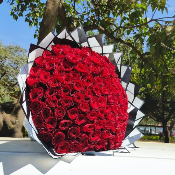 The 100stem Red Roses Bouquet and customized card.